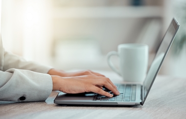 prospective client typing on laptop
